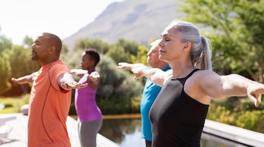 Middle-aged woman participating in body exercise class.